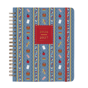 The Rifle Paper Co. Schoolhouse Collection features a blue spiral-bound planner adorned with red and white school-themed designs—apples, pencils, books, scissors—and a red label on the cover that reads “2026 2027 17-Month Planner” in gold text, making it perfect for organizing desk supplies or as a thoughtful teacher gift to brighten any Schoolhouse setting.