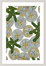 The Kew Collection #1 by Natural Curiosities features overlapping gray and gold circles with bold green leaves on white, presented in an acrylic box frame—ideal for bringing a calming, modern greenhouse feel to your space.