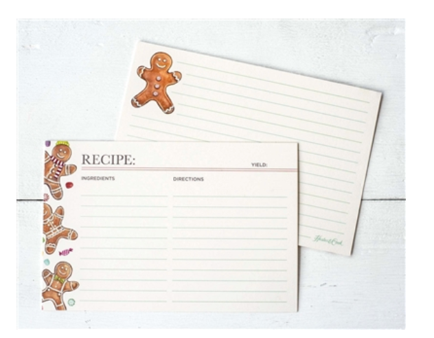 Two Gingerbread Partyware Collection recipe cards decorated with gingerbread men, serving as festive table accents with sections for ingredients, directions, and yield.