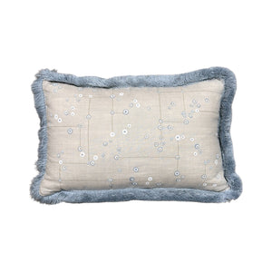 The Klimt Down Lumbar Pillow by Beleo Interiors LLC features a rectangular beige design with blue decorative fringe and small white circle patterns, perfect for lumbar support.