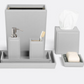 The Rothwell Bath Collection by Pigeon & Poodle is a matching grey set crafted from durable yacht leather and water-resistant materials, including a waste bin, tissue box cover, soap dispenser, toothbrush holder, tray, and soap dish with soap.