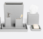 The Rothwell Bath Collection by Pigeon & Poodle is a matching grey set crafted from durable yacht leather and water-resistant materials, including a waste bin, tissue box cover, soap dispenser, toothbrush holder, tray, and soap dish with soap.
