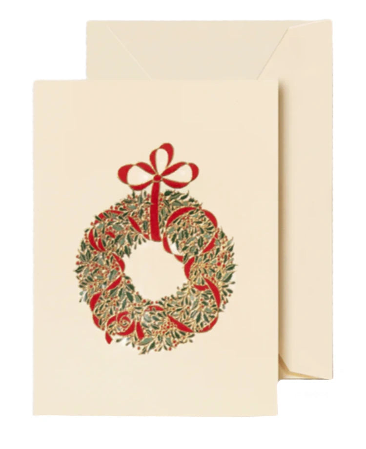 The Classic Wreath Gift Enclosure Set by Crane features a cream-colored folded card with an engraved green wreath and red ribbon, paired with a matching envelope.