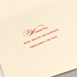 The Ribbon Flourish Merry Christmas Card Set by Crane features cream-colored cards with red engraved text reading, "Wishing you peace, health and happiness throughout the year.