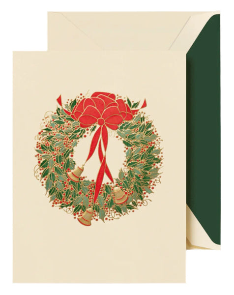 Introducing the "Crane Holly Wreath with Bells Card Set" by Crane, a holiday card set showcasing a classic season's greeting with a holly wreath embellished with a red bow and bells, complete with an envelope.