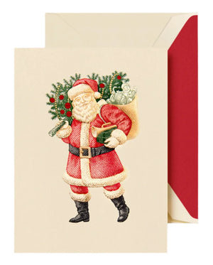 The Classic Santa Card Set by Crane features a cream card with Santa holding a scroll and gift, a sack and greenery on his shoulder, and includes a red envelope.