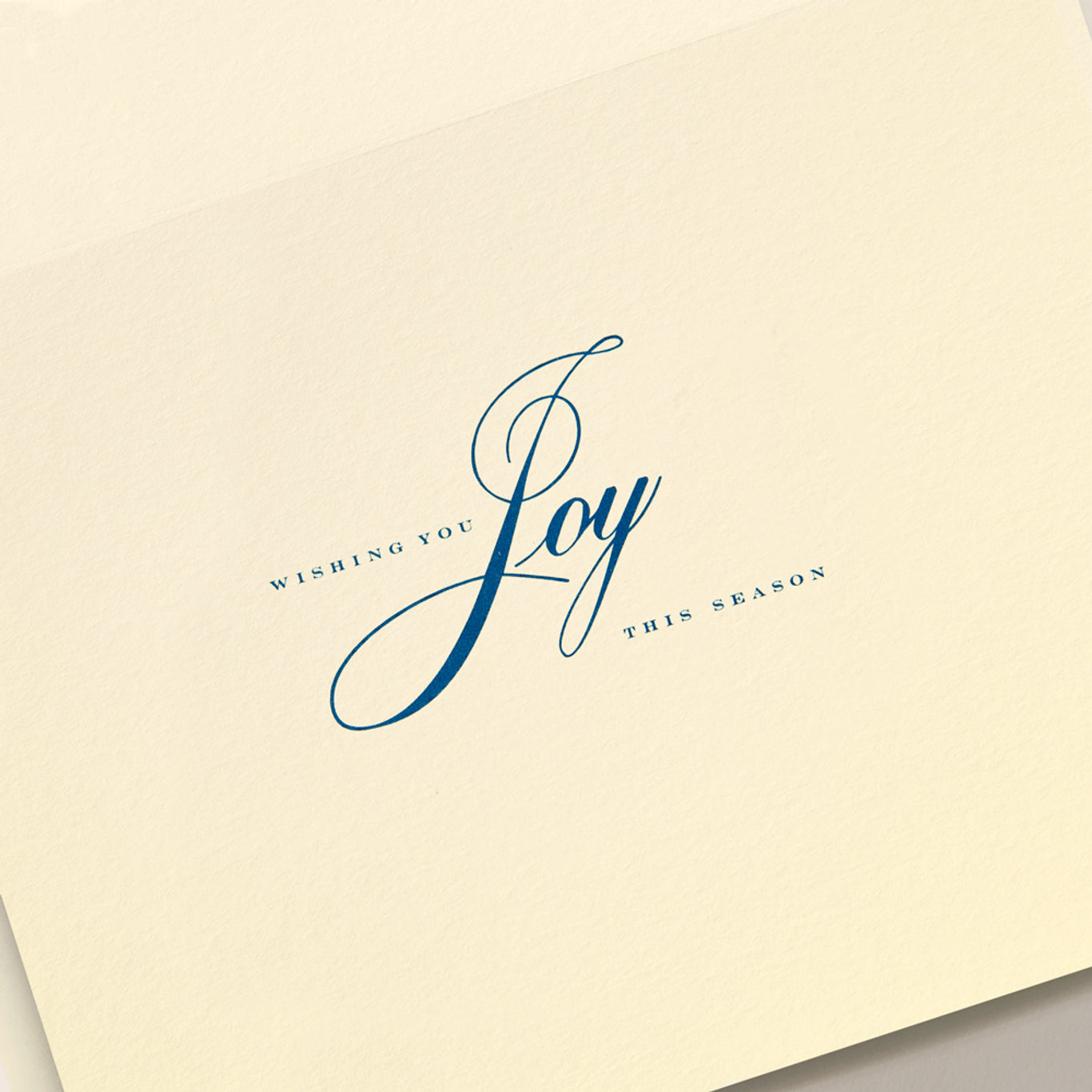 The Crane Nativity Christmas Card Set features a cream-colored card with "Wishing you Joy this holiday season" in elegant blue script and serif fonts.