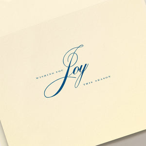 The Crane Nativity Christmas Card Set features a cream-colored card with "Wishing you Joy this holiday season" in elegant blue script and serif fonts.