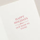 The Crane Red Berry Wreath Card Set by Crane features a holiday card with vibrant red text saying, "Happy Holidays from our home to yours," beautifully set against a crisp white background and complemented by elegantly engraved foliage.