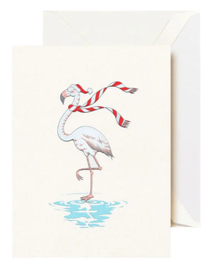 The Crane Festive Flamingo Card Set features greeting cards with a winter flamingo—wearing a Santa hat and red striped scarf, standing on one leg in water—with envelopes included.