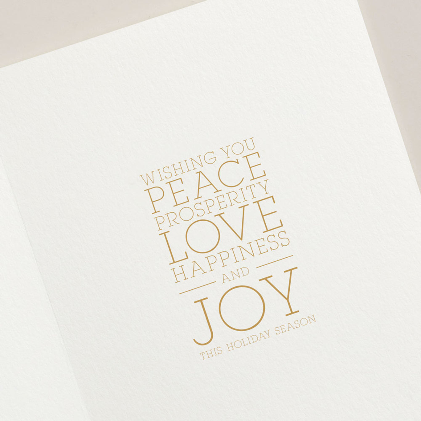 The Crane Nutcracker Soldier Card Set from Crane features a holiday card with the message "Wishing you peace, prosperity, love, happiness, and joy this festive occasion" in gold text on a white background.