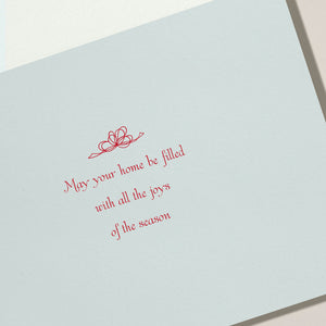 The Crane Elegant Christmas Seashells Card Set features a card with red script reading "May your home be filled with all the joys of the season" above a bow sketch—ideal for warm seaside holiday greetings.