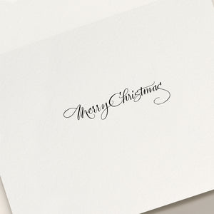 The Skating Noel Holiday Card Set by Crane features elegant black cursive "Merry Christmas" lettering on a white card, perfect for spreading festive cheer.
