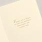 The Crane Faith Hope Peace Love Card Set features an open holiday card with "Wishing you a world of peace and happiness throughout the coming year" engraved in elegant brown serif font on cream-colored paper.
