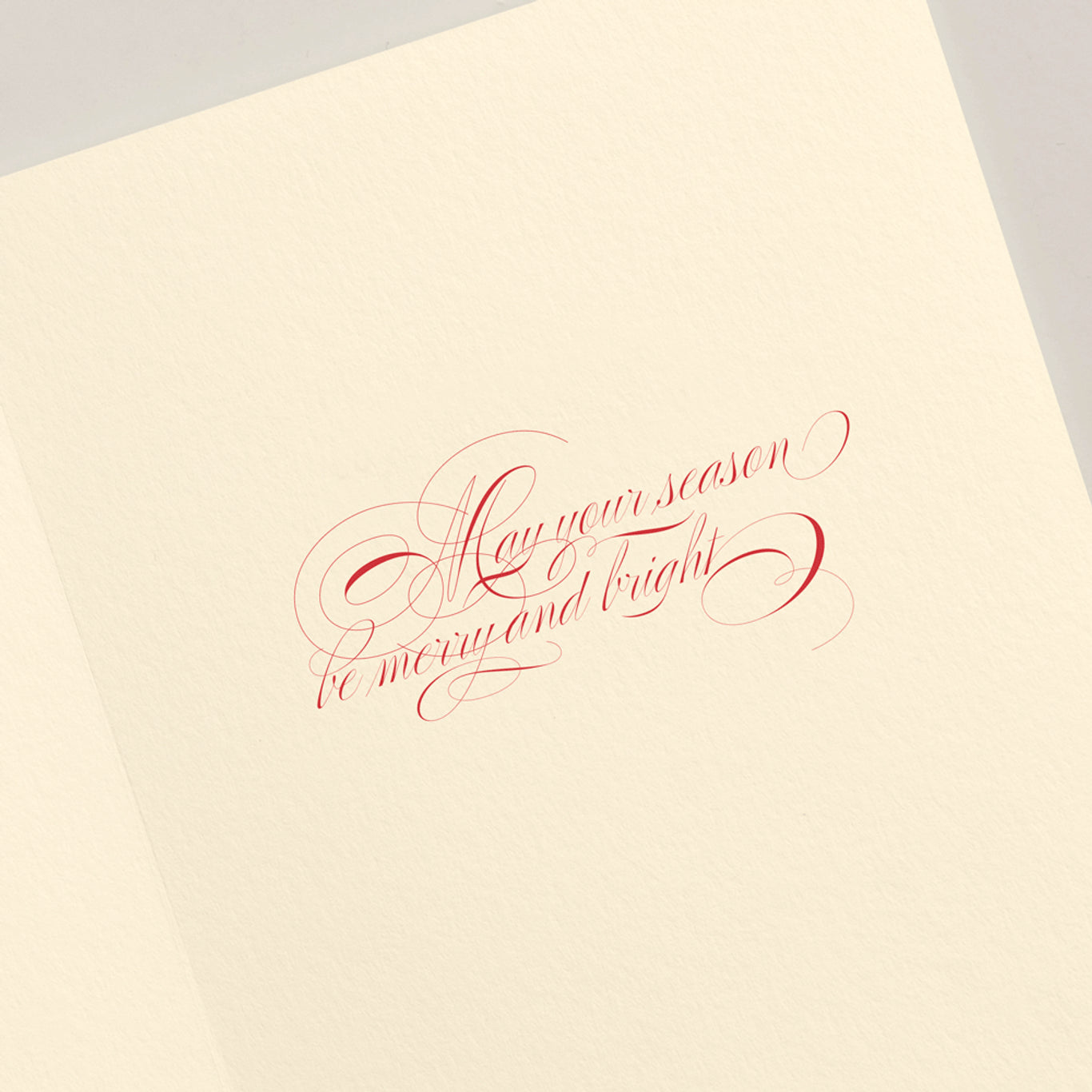 The Crane Filigree Ornament Card Set features cream-colored cards with red cursive text, "May your season be merry and bright"—perfect for sending warm wishes or adding elegance to your holiday décor.
