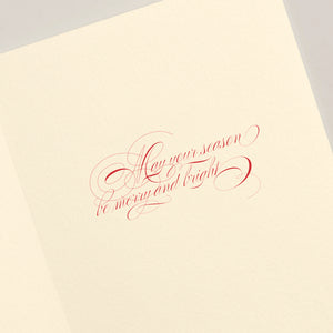 The Crane Filigree Ornament Card Set features cream-colored cards with red cursive text, "May your season be merry and bright"—perfect for sending warm wishes or adding elegance to your holiday décor.