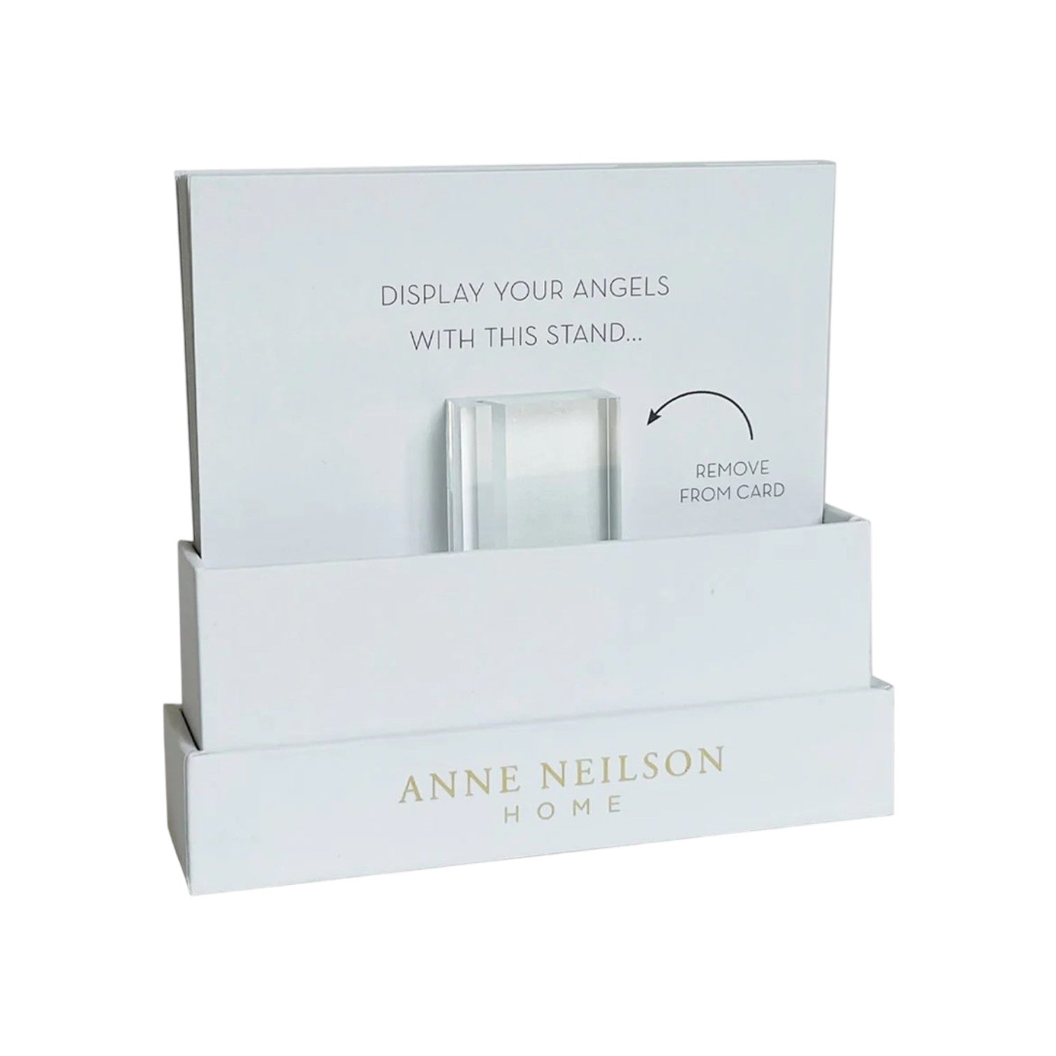 A white Anne Neilson display stand holds an instruction card for displaying Anne Neilson: Hope Scripture Cards. Remove the clear stand from the card to showcase inspirational Bible verses or scripture cards.