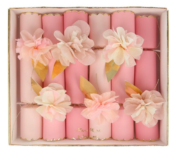 The Meri Meri Tissue Floral Crackers Pink, adorned with paper flowers and gold leaves, are perfect for a princess party.