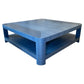The Series O Custom Cocktail Table by T3 Custom Furniture is a square blue piece with rounded corners, a lower shelf, and a textured azure finish inspired by Manila hemp.