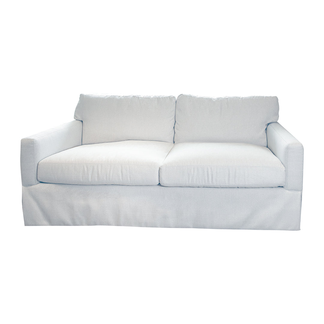The Blair Apartment Sofa in Perennials Oyster Raffia by Lee Industries is a compact, two-seat white sofa with a skirted base and two back cushions, shown against a plain white background.
