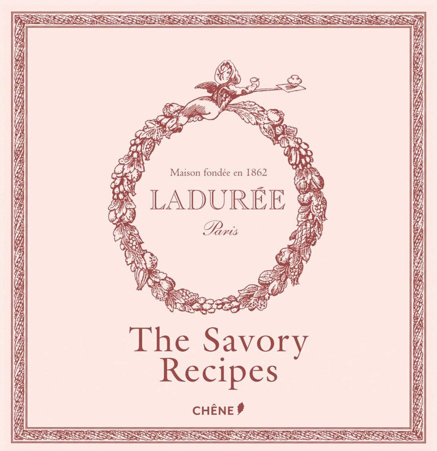 A pale pink book cover adorned with a floral wreath, featuring the text “Ladurée” and the title “The Savory Recipes” in bold lettering beneath—evoking the charm of the renowned Parisian tea salon where the macaron originated—published by Simon & Schuster.