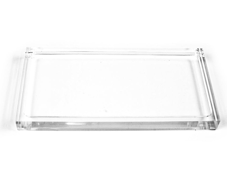 Clear rectangular L’Avant Collective Lucite Soap & Candle Tray with a minimalist design.