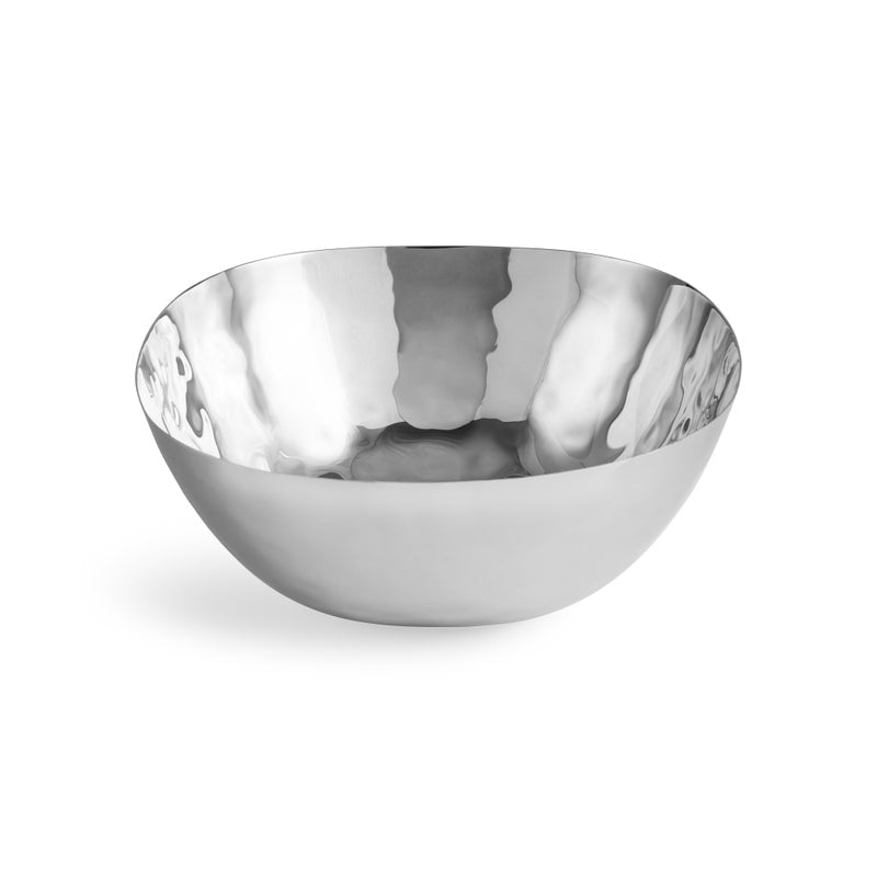 The Reflective Serveware Collection by Michael Aram features hammered, high-polished stainless steel bowls with smooth edges, ideal for enhancing modern aesthetics in your space.