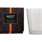 The Sicilian Tangerine Candle Collection by Nest features premium wax candles in a decorative black and orange box, bringing vibrant fragrance to any space.