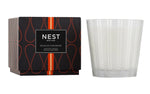 The Sicilian Tangerine Candle Collection by Nest features premium wax candles in a decorative black and orange box, bringing vibrant fragrance to any space.