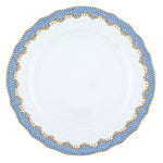 A white ceramic plate with a decorative scalloped edge, featuring a blue and gold patterned border, evokes artistic appreciation reminiscent of the Herend Fish Scale Light Blue Collection by Herend.