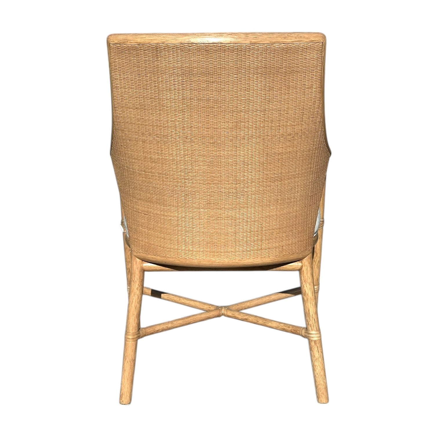 The McGuire Passage Arm Chair features a quality wooden frame, woven backrest, and X-shaped base support, elegantly viewed from the back against a white background.