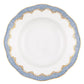 The Herend Fish Scale Light Blue Collection plate by Herend features a round, white ceramic design with a scalloped edge, adorned with intricate blue and gold patterns along the rim, showcasing hand-painted artwork that invites artistic appreciation.