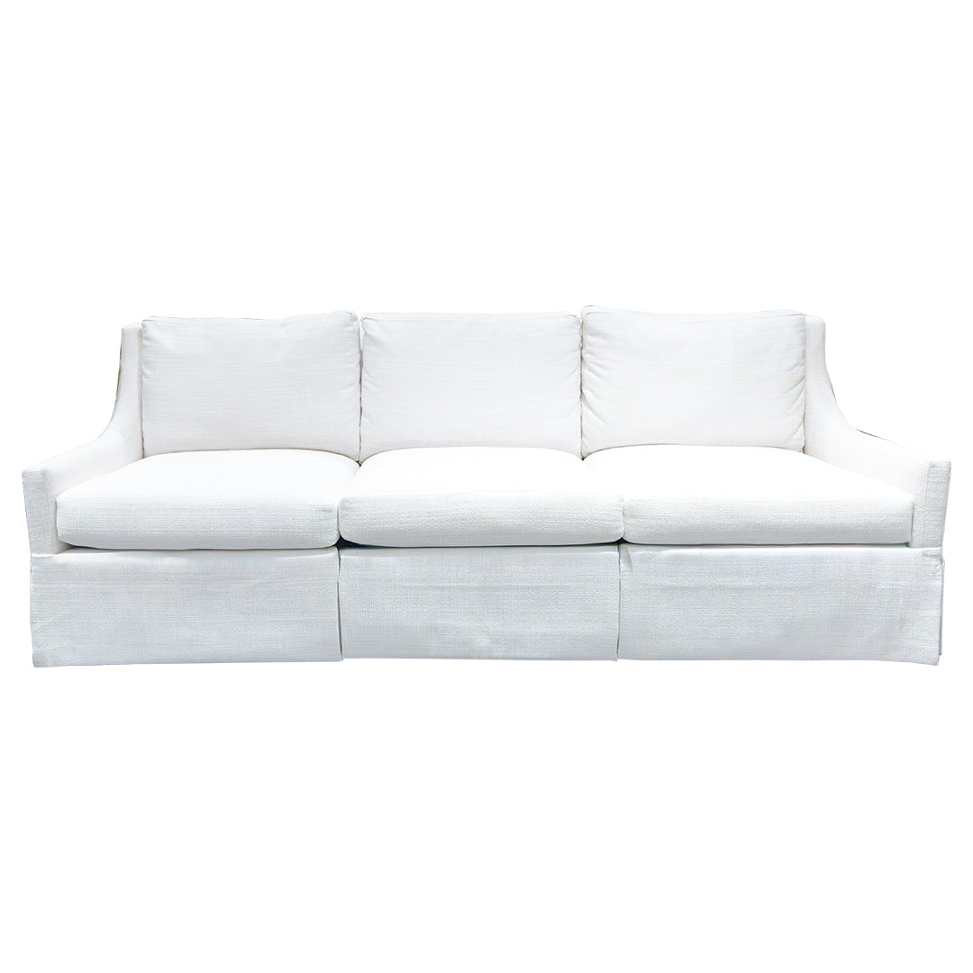 The Chatham Dressmaker Sofa in Homespun Sea Salt by Hickory Chair is a three-seat white sofa with three seat cushions and three back cushions, featuring straight arms and a skirted base that showcases tailored construction reminiscent of classic English club chair style.