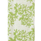 A folded white towel with a green floral design and scallop trim from the Weezie Towels x Meg Braff Bath Collection evokes a Palm Beach summer.