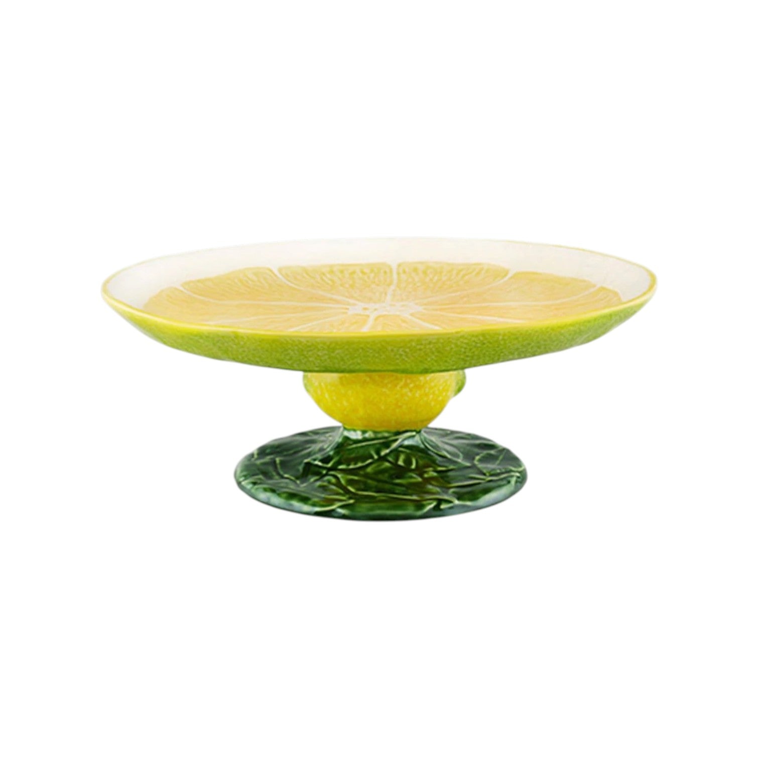The Lemon Collection cake stand by Bordallo Pinheiro is a whimsical ceramic piece with a lemon slice design on top, yellow sides, and a green leaf-textured base.