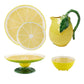 Add citrus charm to your kitchen with the Lemon Collection by Bordallo Pinheiro—whimsically shaped and painted lemon tableware, including a large plate, small plate, pitcher with leaf handle, pedestal dish, and bowl.