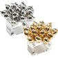 The Jubilee Napkin Ring by Kim Seybert features clusters of metallic balloon shapes atop clear square bands in silver and gold—an elegant accent to elevate your festive table setting.