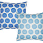 The Aleesa Outdoor Pillows by John Robshaw feature two square designs with white backgrounds and circular floral patterns—one in dark blue, one in light blue. Durable and stylish, they resist sun and rain for long-lasting outdoor use.