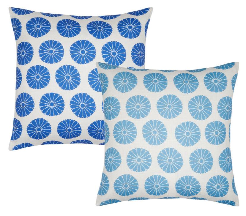 The Aleesa Outdoor Pillows by John Robshaw feature two square designs with white backgrounds and circular floral patterns—one in dark blue, one in light blue. Durable and stylish, they resist sun and rain for long-lasting outdoor use.