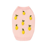 The Icon Sweater by Found My Animal is a light pink knit dog sweater featuring evenly spaced small yellow lemons and green leaves on the front.