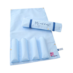 The Let’s Rack & Roll Mahjong Bag by Oh My Mahjong features a light blue foldable mat with four padded sections, snap buttons, a matching roll-up rack, and a bag printed with “let’s rock & roll!” Perfect for stylish game storage.