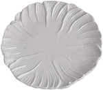 A white ceramic plate from the Vida Lettuce Dinnerware Collection by Beatriz Ball features a textured, leaf-inspired pattern radiating outward from the center.