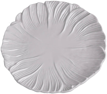 A white ceramic plate from the Vida Lettuce Dinnerware Collection by Beatriz Ball features a textured, leaf-inspired pattern radiating outward from the center.
