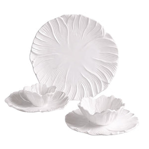 Three white ceramic dishes from the Vida Lettuce Dinnerware Collection by Beatriz Ball, featuring a floral, petal-like texture—includes two bowl-and-plate sets and one large dinner plate.