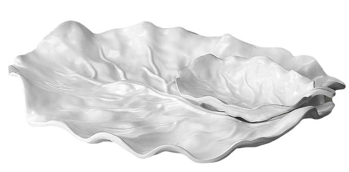 Two white leaf-shaped serving dishes—one large, one small—from the Beatriz Ball Vida Lettuce Serveware Collection are nested together on a plain background, highlighting the elegant luxury melamine design.