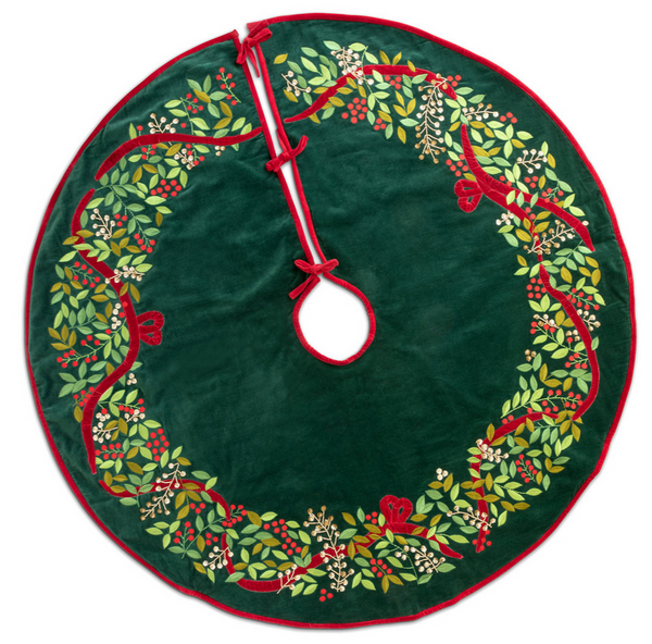 The Park Hill Collection Christmas Wreath Velvet Tree Skirt, circular and green with red trim, featuring a decorative pattern of leaves and berries, is the perfect Christmas decor.