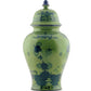 The Ginori 1735 Oriente Italiano Malachite vase features blue floral patterns and a finial lid, inspired by the brand’s iconic dinnerware collection.