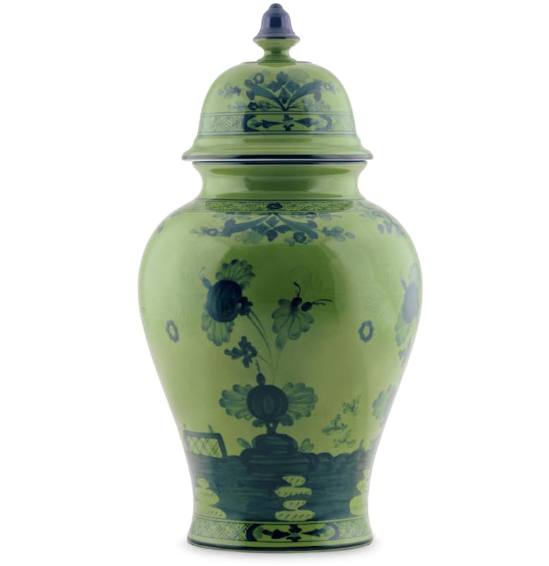 The Ginori 1735 Oriente Italiano Malachite vase features blue floral patterns and a finial lid, inspired by the brand’s iconic dinnerware collection.