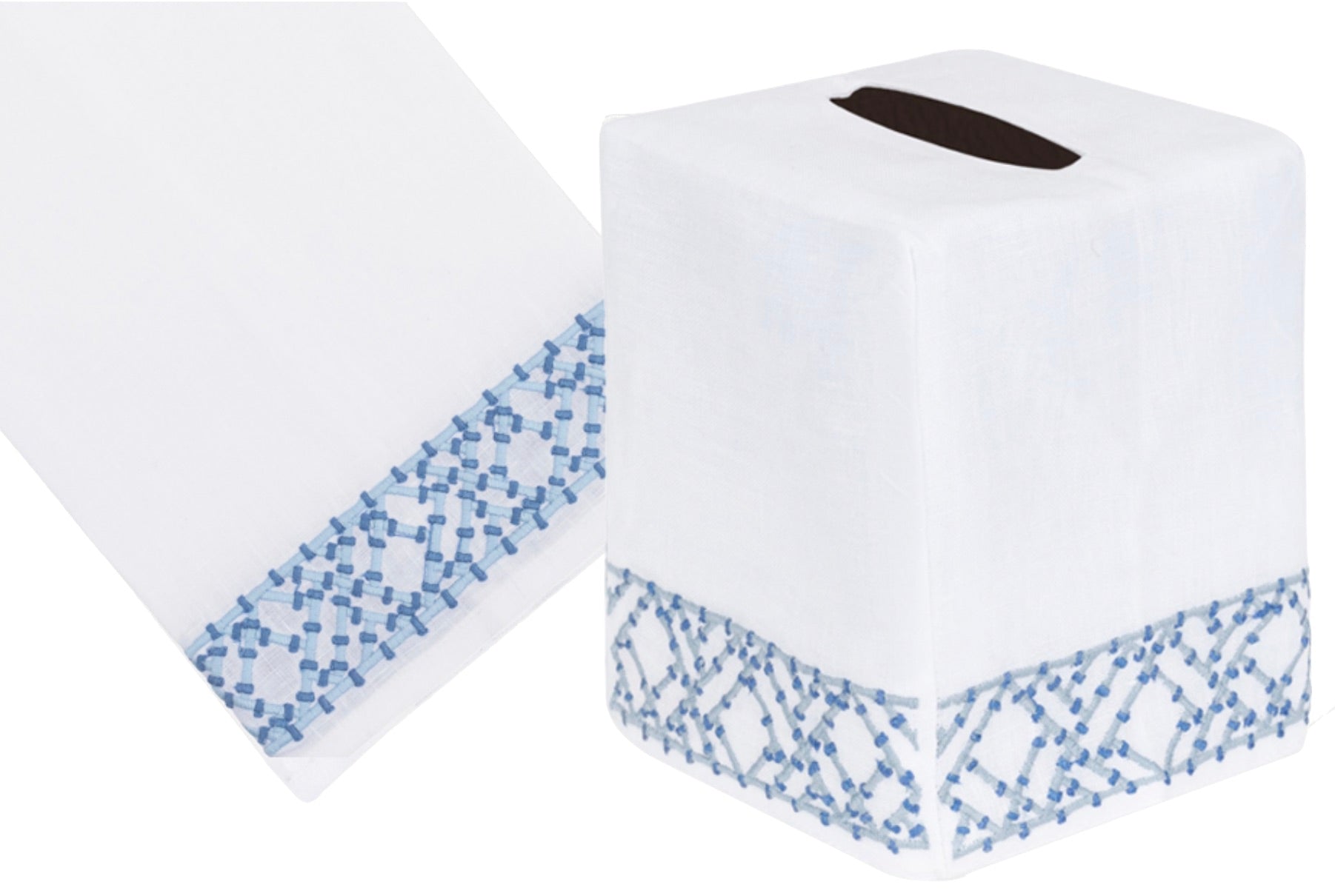 The Lido Bath Collection by Haute Home offers a white tissue box cover made from luxurious Italian linen with elegant blue geometric hand embroidery along the bottom edge.
