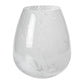 The Zodax Liguria Confetti Glass Vase features a round base and subtle white marbled patterns, making it an elegant décor piece for any space.